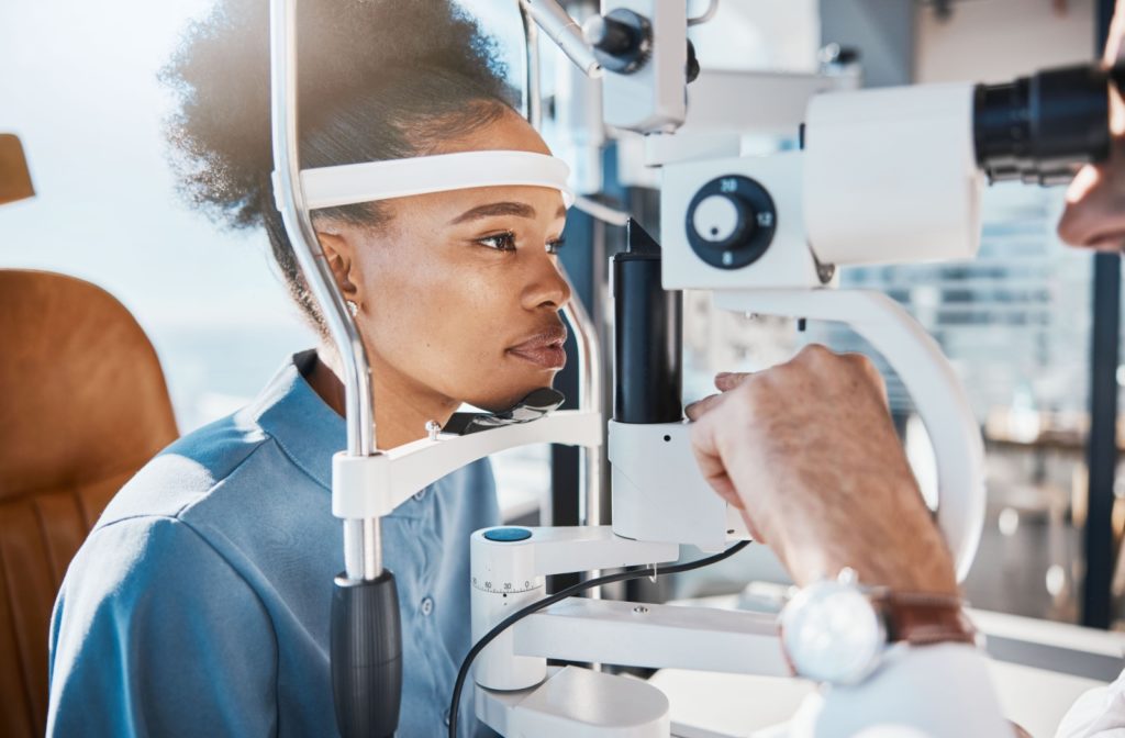 a young woman is getting her eyes examined for myopia bilateral