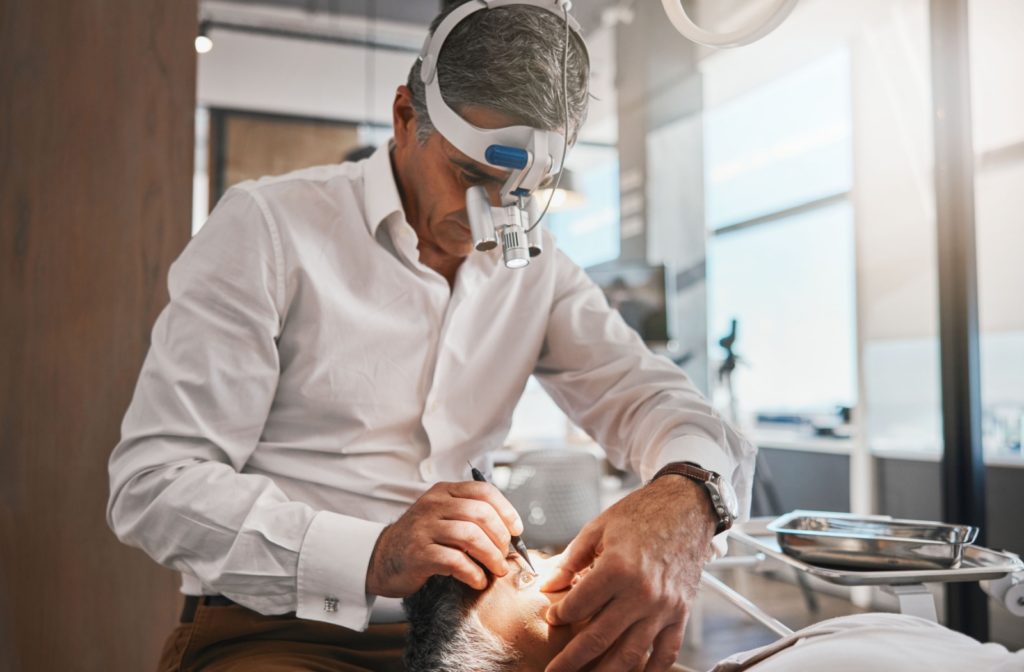 An ophthalmologist performs a safe and effective cataract surgery on a senior patient.